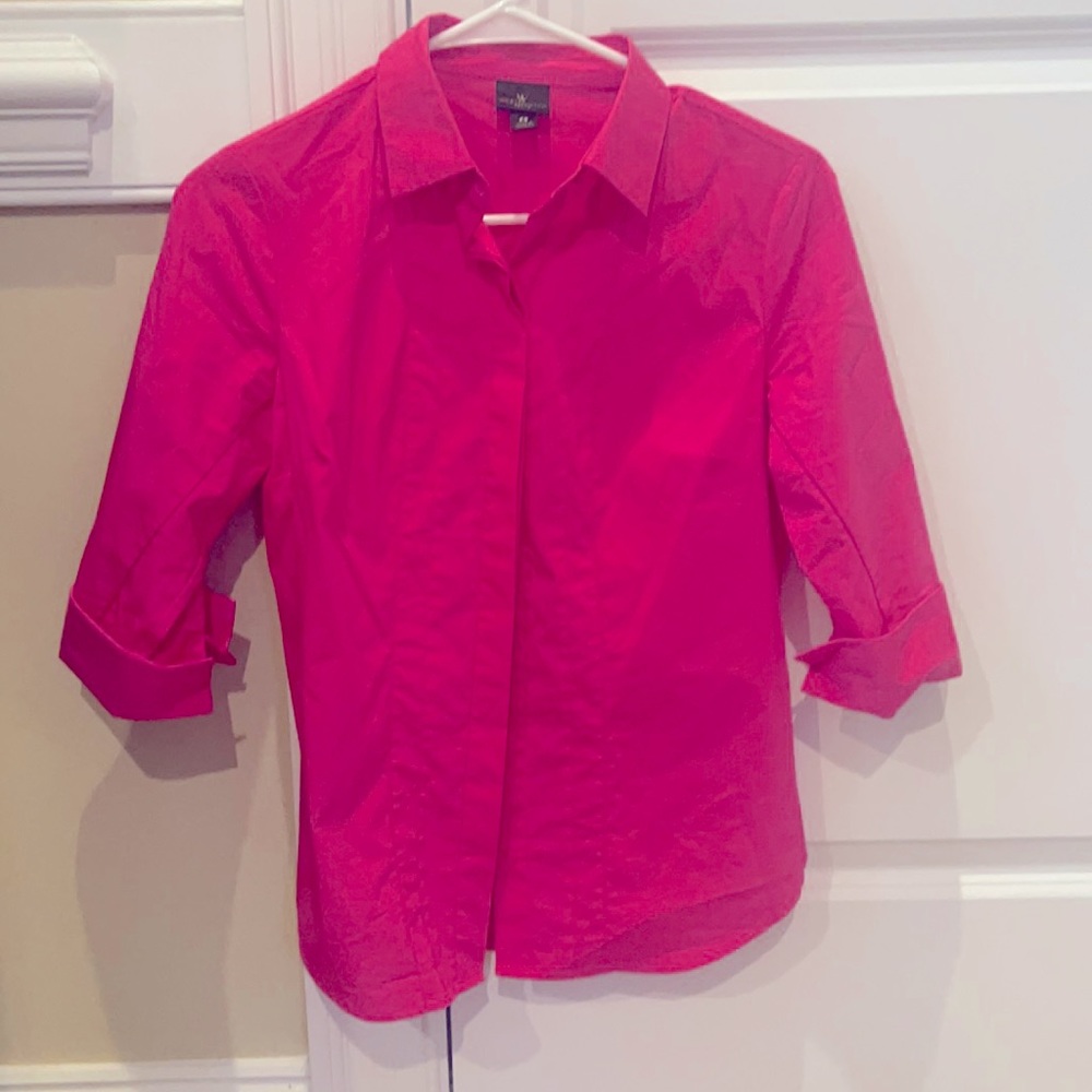 This blouse is in excellent condition. Material is softy stretchy.